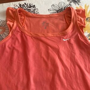Nike Dri- Fit melon orange athletic tank with ruffles on shoulders.